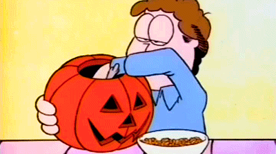 John Arbuckle from Garfield, emptying the 'guts' from a pumpkin he's carving.