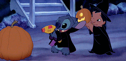 Disney's Lilo and Stitch dressed in Halloween costumes; Stitch 'carves' a jack-o-lantern with a raygun