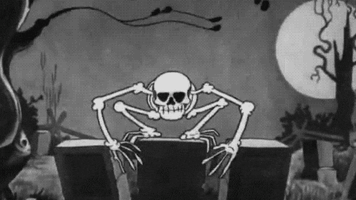 A black and white cartoon of a skeleton jumping towards the camera; the camera goes into its mouth and out its ribcage