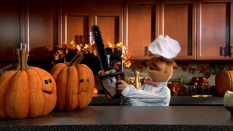 The Swedish Chef from The Muppets, wielding a chainsaw to carve pumpkins.