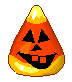 a candy corn with a glowing jack-o-lantern face